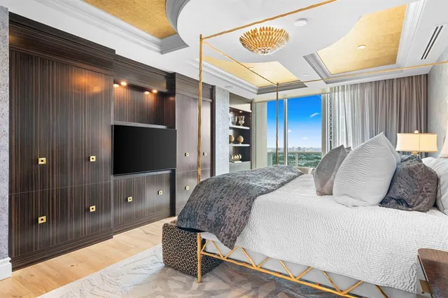 a bed room with a bed and a night stand