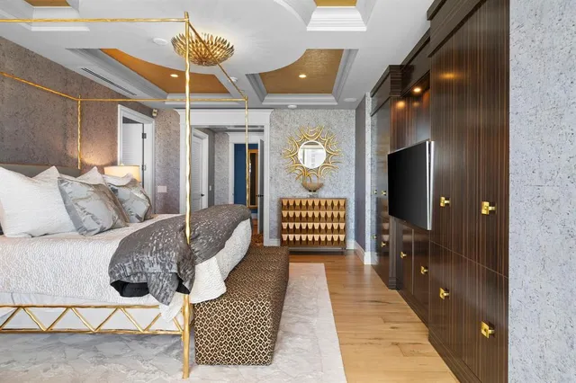 a bathroom with a sink a large mirror and a bathtub