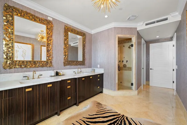 a bathroom with a double vanity sink mirror and shower