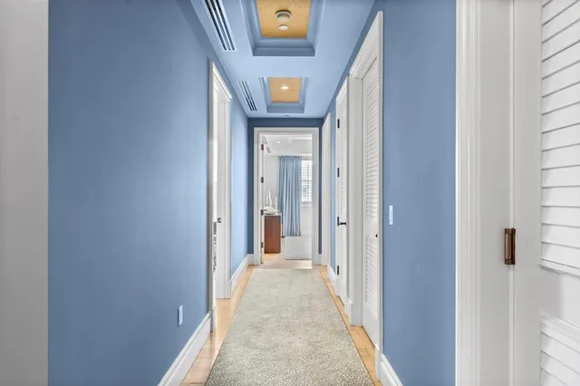 a bedroom with a bed and a lamp