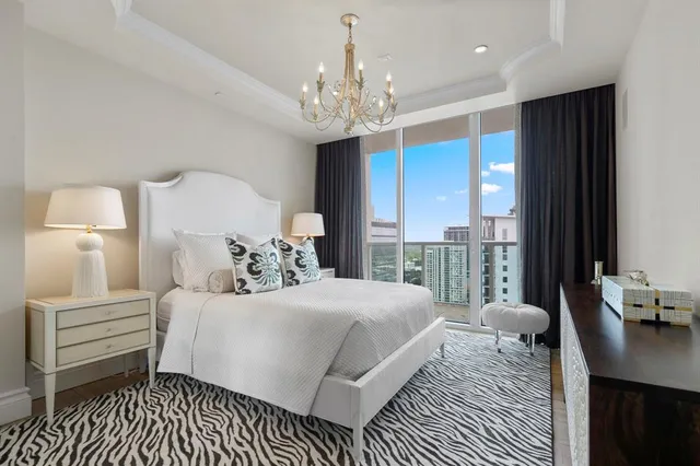 a bathroom with a granite countertop toilet and a sink