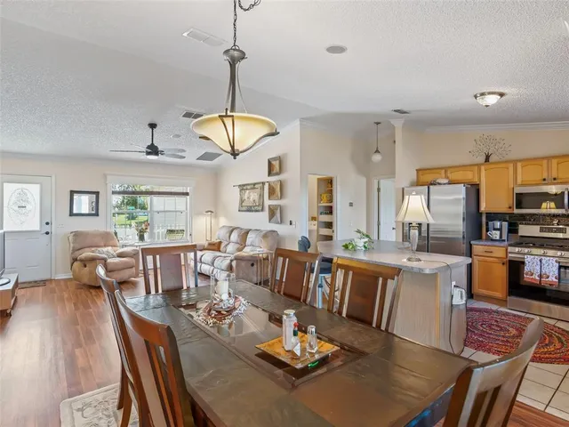 a living room with lots of furniture and a chandelier