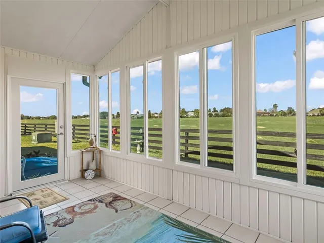 a view of a living room and windows