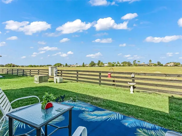 a view of a golf course with a ocean view