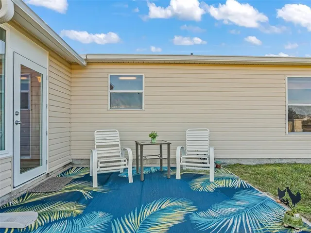 a view of front door and porch with seating space