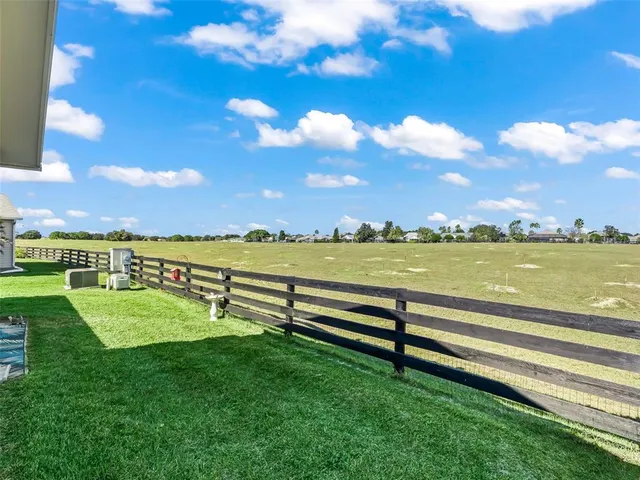 a view of a lake with houses in the back