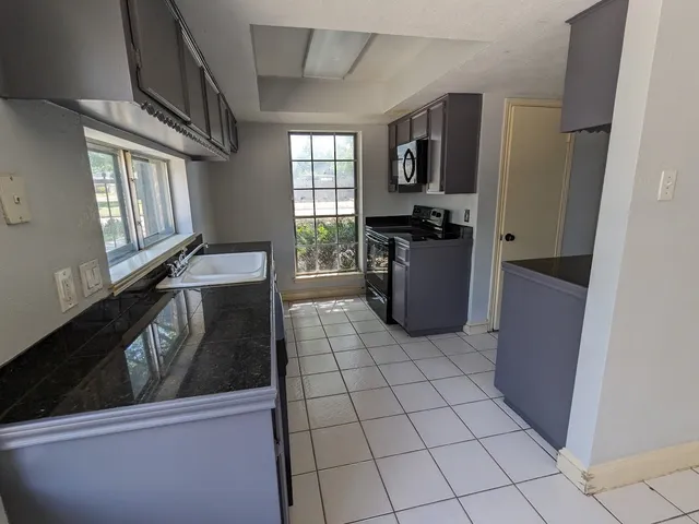 a view of a kitchen with a sink