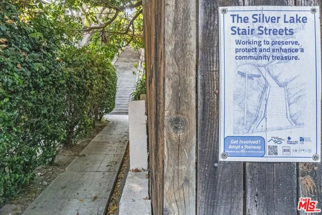 a view of a house with a yard and plants