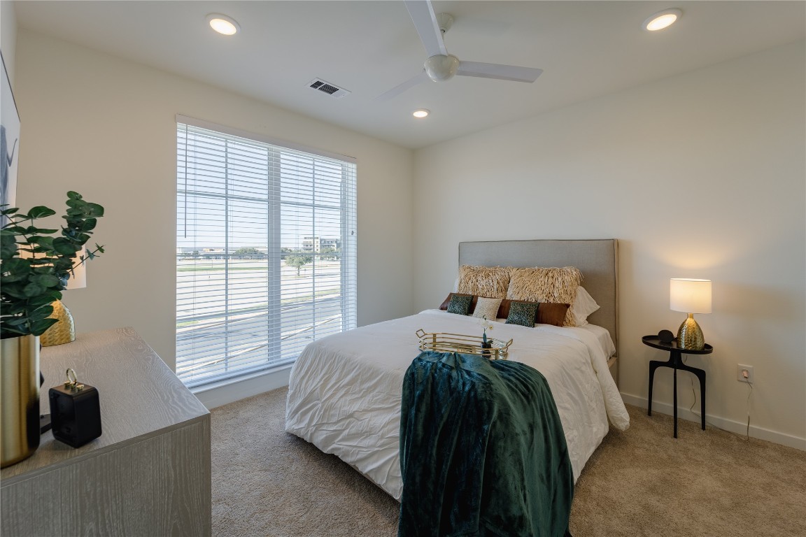 604 East Highland Mall Boulevard, Unit 418314 Austin, TX 78752 - Photo 4 of 10 a bedroom with a bed and a window