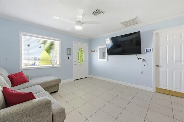 a kitchen with stainless steel appliances granite countertop a refrigerator a stove a sink and a microwave