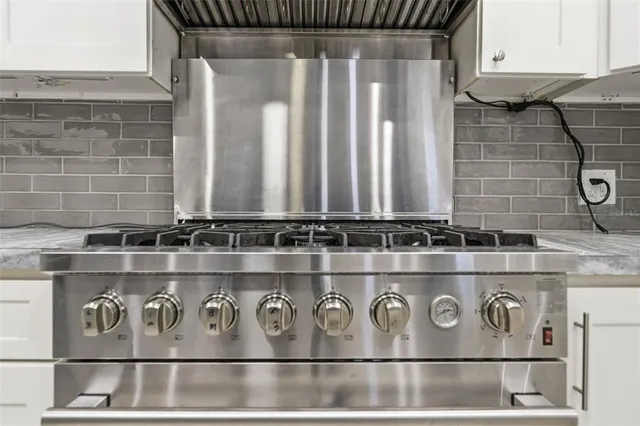 a view of a dining room with furniture and window