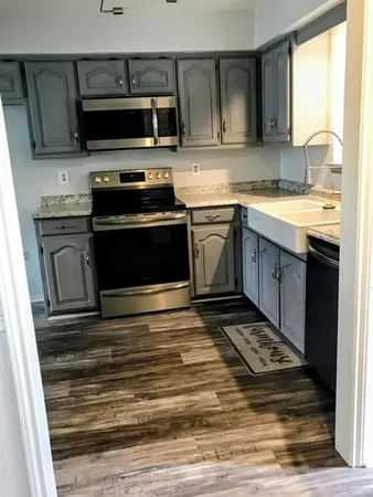 a kitchen with a stove and a microwave