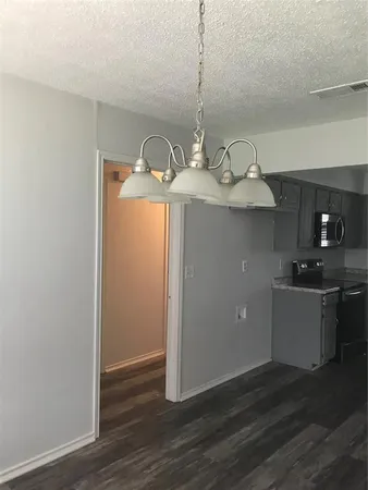 a kitchen with kitchen island stainless steel appliances a sink and stove