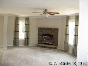 259 Ernest Rogers Road Clyde, NC 28721 - Photo 2 of 12 a view of a livingroom with a fireplace