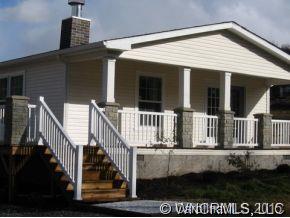 259 Ernest Rogers Road Clyde, NC 28721 - Photo 12 of 12 a view of a house with wooden fence