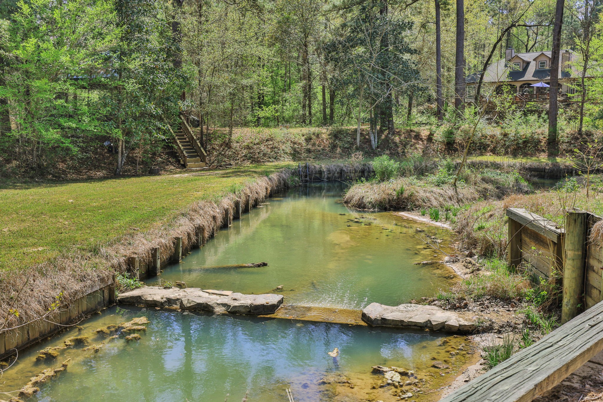 250 Critter Creek Road Coldspring, TX 77331 - Photo 5 of 48 Bulkheaded area close to the main home and pavilion area