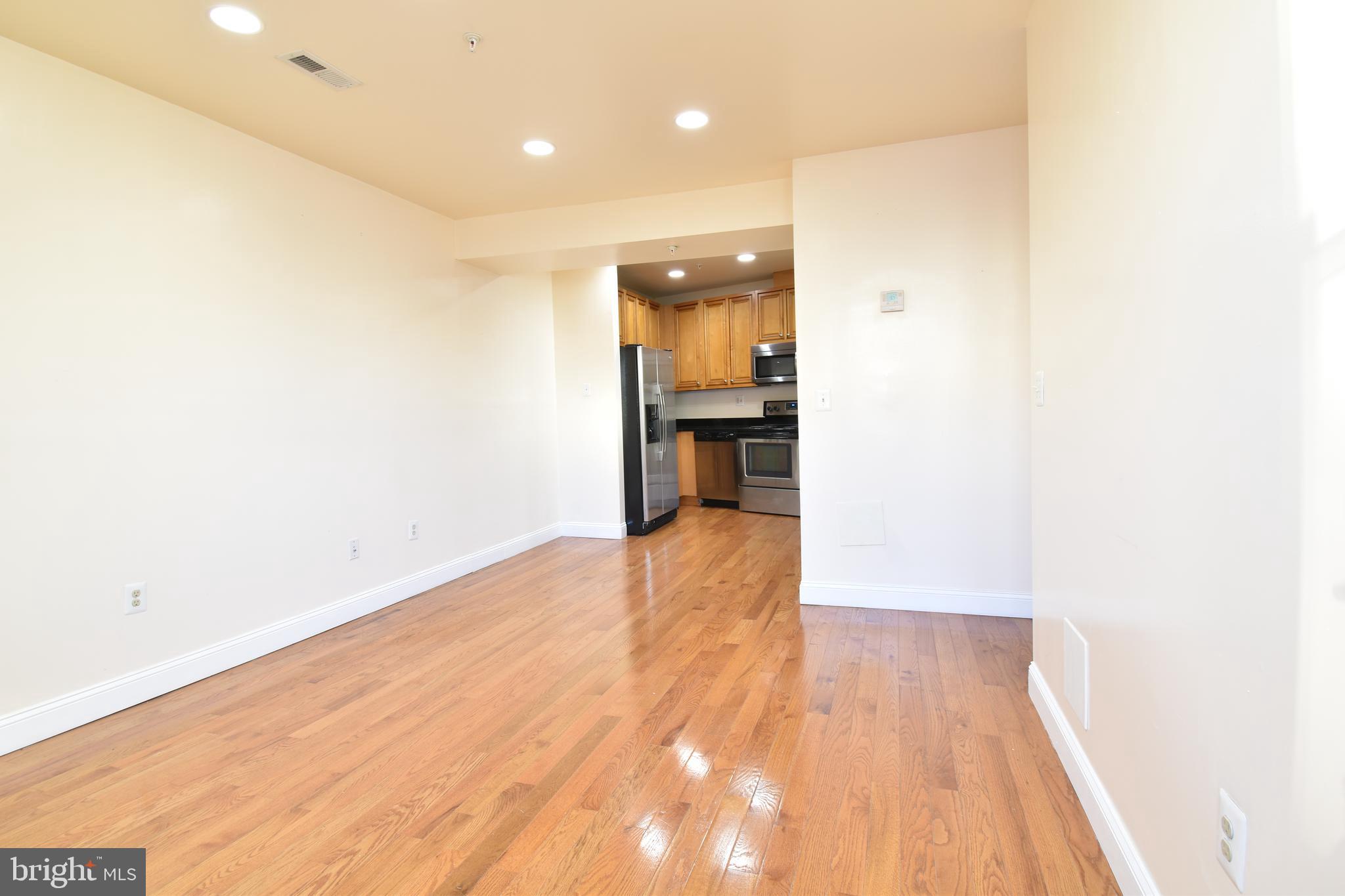 3408 Sherman Avenue Northwest, Unit 202 Washington, DC 20010 - Photo 5 of 20 a view of a kitchen with a sink and a stove