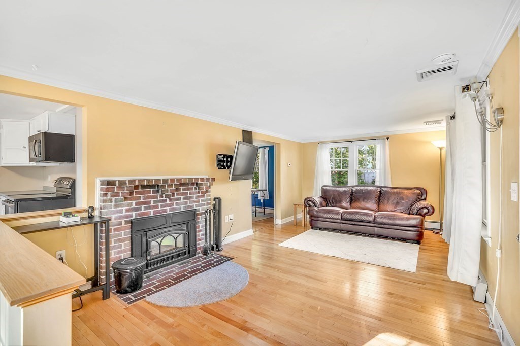 16 Fuller Road Billerica, MA 01821 - Photo 11 of 40 a living room with furniture and a fireplace