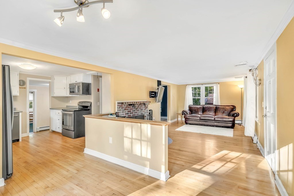 16 Fuller Road Billerica, MA 01821 - Photo 12 of 40 a kitchen with stainless steel appliances kitchen island granite countertop a refrigerator and stove