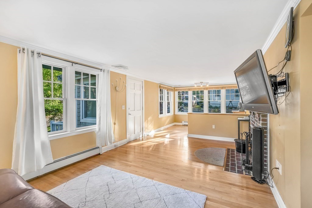 16 Fuller Road Billerica, MA 01821 - Photo 14 of 40 a view of an empty room with wooden floor and a window