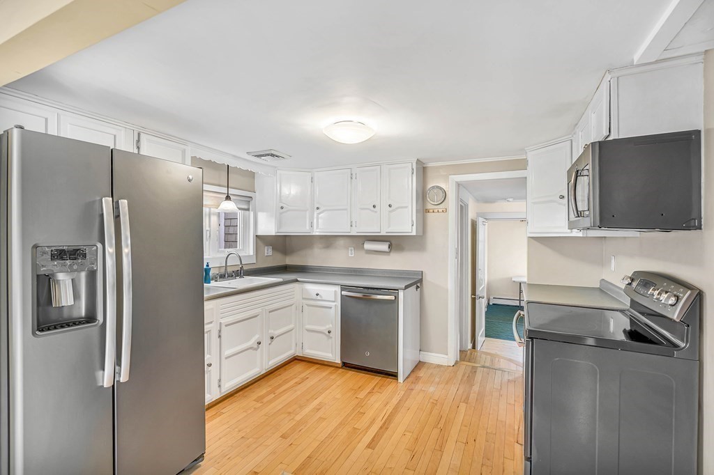 16 Fuller Road Billerica, MA 01821 - Photo 15 of 40 a kitchen with a refrigerator sink and stove