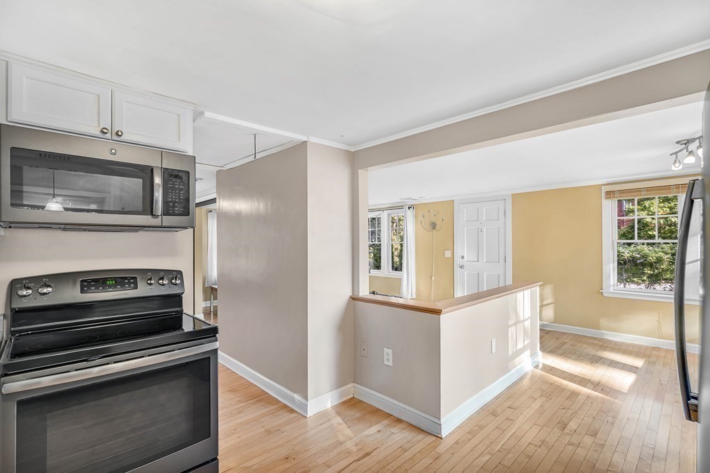 16 Fuller Road Billerica, MA 01821 - Photo 17 of 40 a kitchen with a stove microwave and a refrigerator