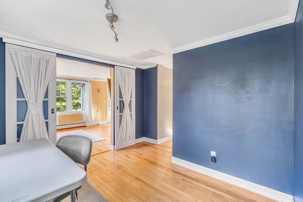 16 Fuller Road Billerica, MA 01821 - Photo 24 of 40 a bedroom with a bed and glass door