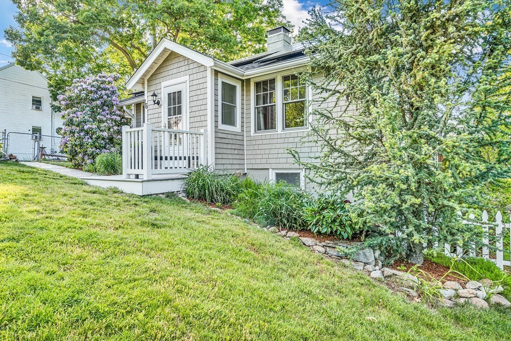 16 Fuller Road Billerica, MA 01821 - Photo 3 of 40 a view of a house with a yard and plants
