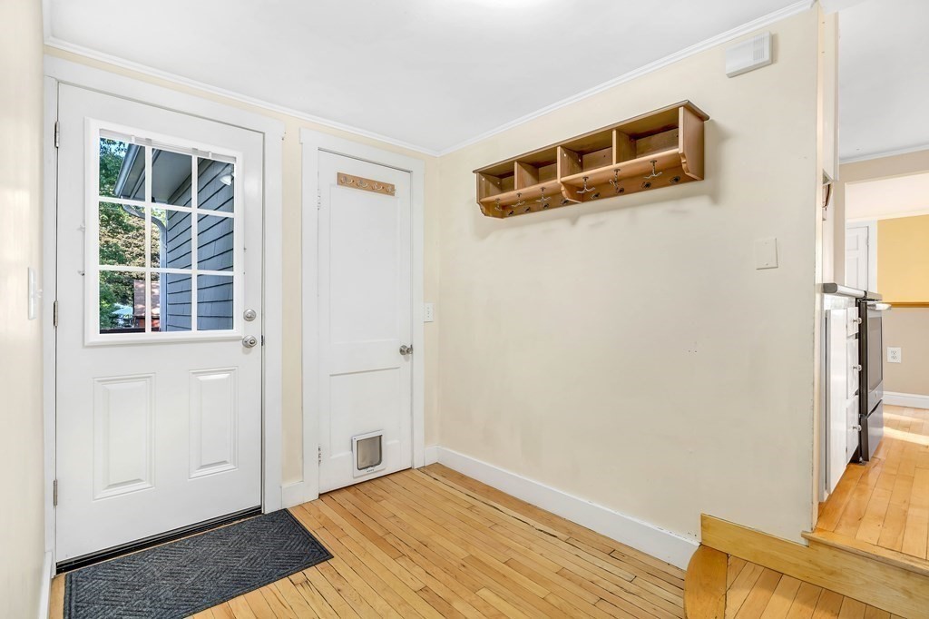 16 Fuller Road Billerica, MA 01821 - Photo 9 of 40 a view of an empty room with wooden floor and a window