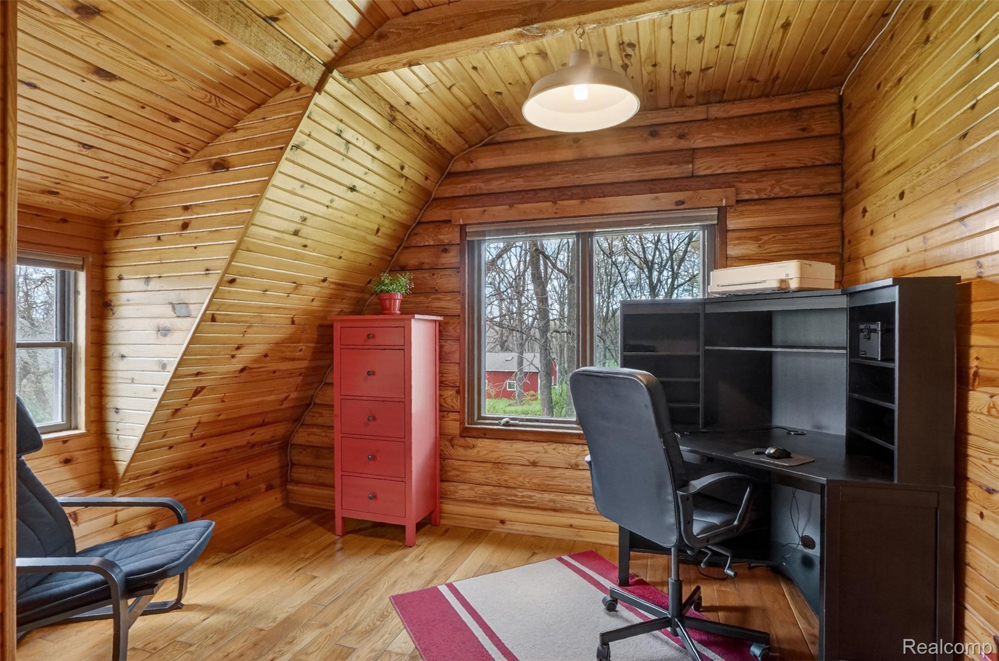2997 Brighton Road Howell, MI 48843 - Photo 19 of 30 Home office with wood ceiling, wood-type flooring, wood walls, and lofted ceiling with beams
