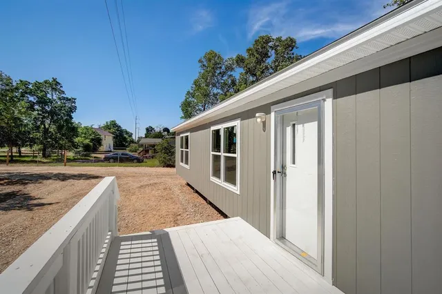 a view of a house with a backyard