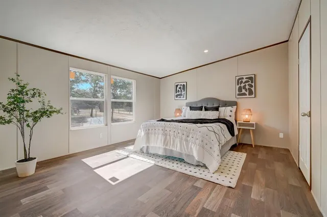 an empty room with windows and closet