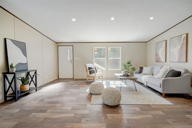a living room with furniture and a table