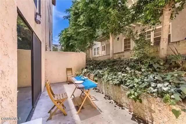 10982 Roebling Avenue, Unit 109 Los Angeles, CA 90024 - Photo 11 of 20 a view of patio with table and chairs and potted plants