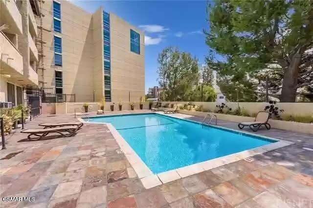 10982 Roebling Avenue, Unit 109 Los Angeles, CA 90024 - Photo 17 of 20 a view of swimming pool with outdoor seating and plants