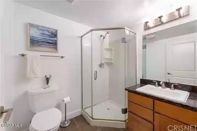 10982 Roebling Avenue, Unit 109 Los Angeles, CA 90024 - Photo 9 of 20 a bathroom with a sink a toilet and shower
