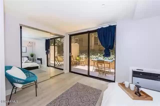 10982 Roebling Avenue, Unit 109 Los Angeles, CA 90024 - Photo 10 of 20 a living room with furniture and a large window