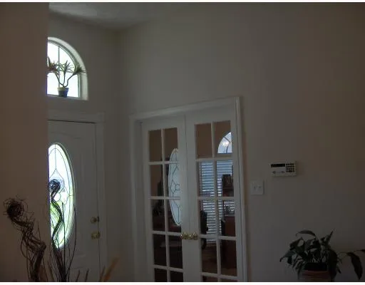 a view of a entryway door with wooden floor