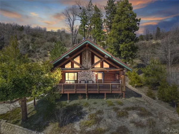 a view of a house with a yard and balcony