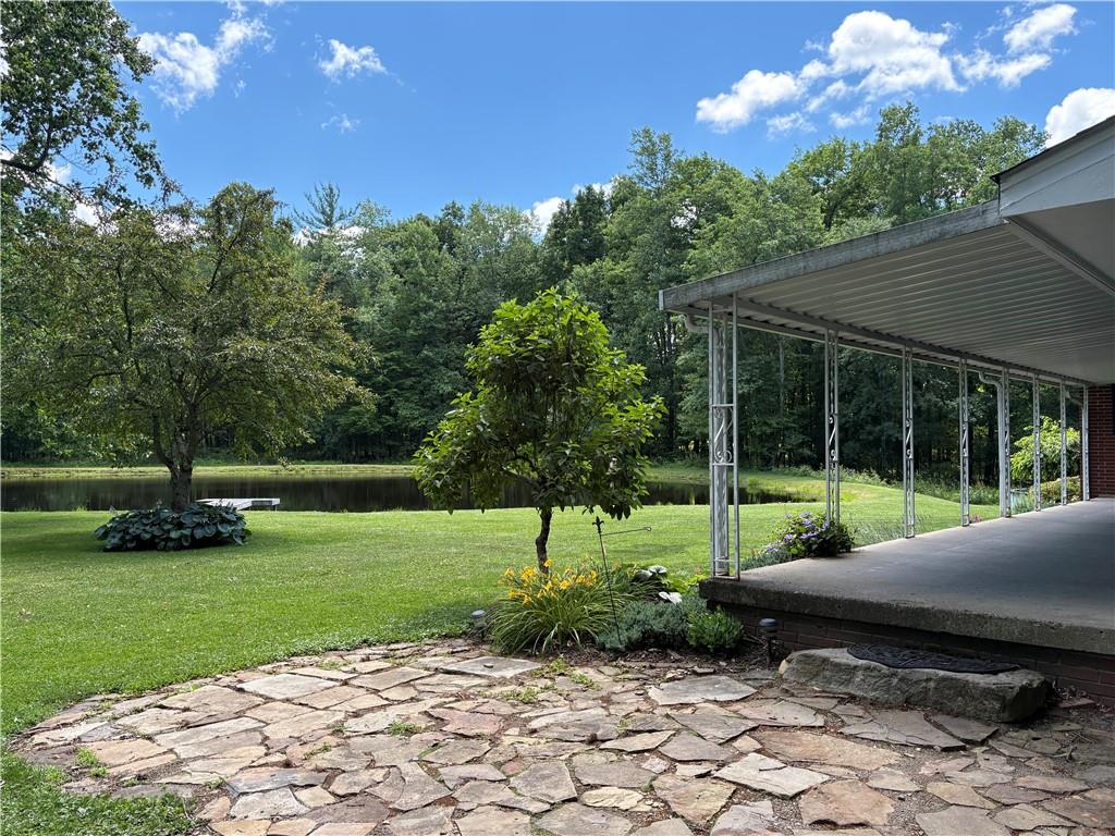320 Cherry Hill Road Greenville, PA 16125 - Photo 37 of 38 a view of a backyard with a garden and entertaining space