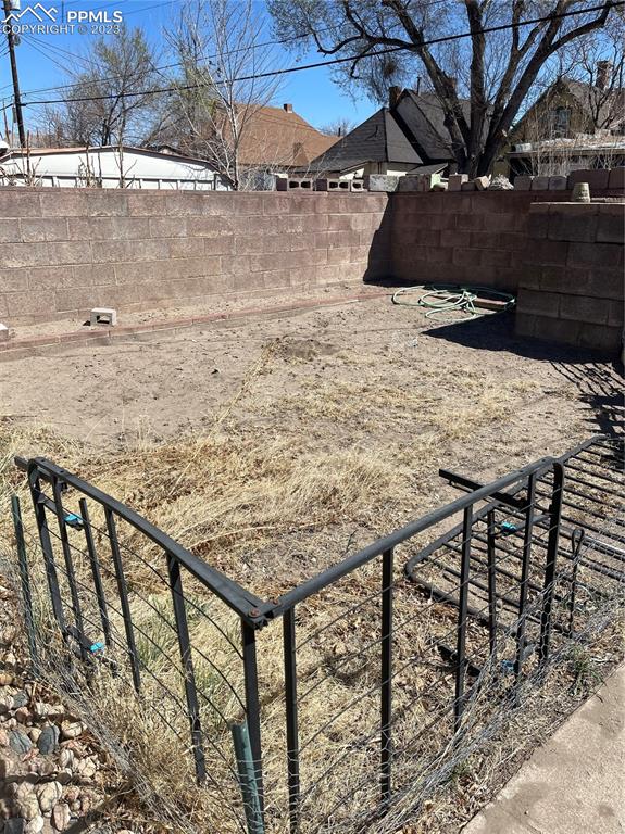 1128 East Routt Avenue Pueblo, CO 81004 - Photo 7 of 8 a view of terrace with wooden fence