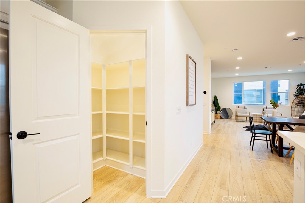 12232 Akira Drive Stanton, CA 90680 - Photo 10 of 39 a view of a living room with a wooden floor