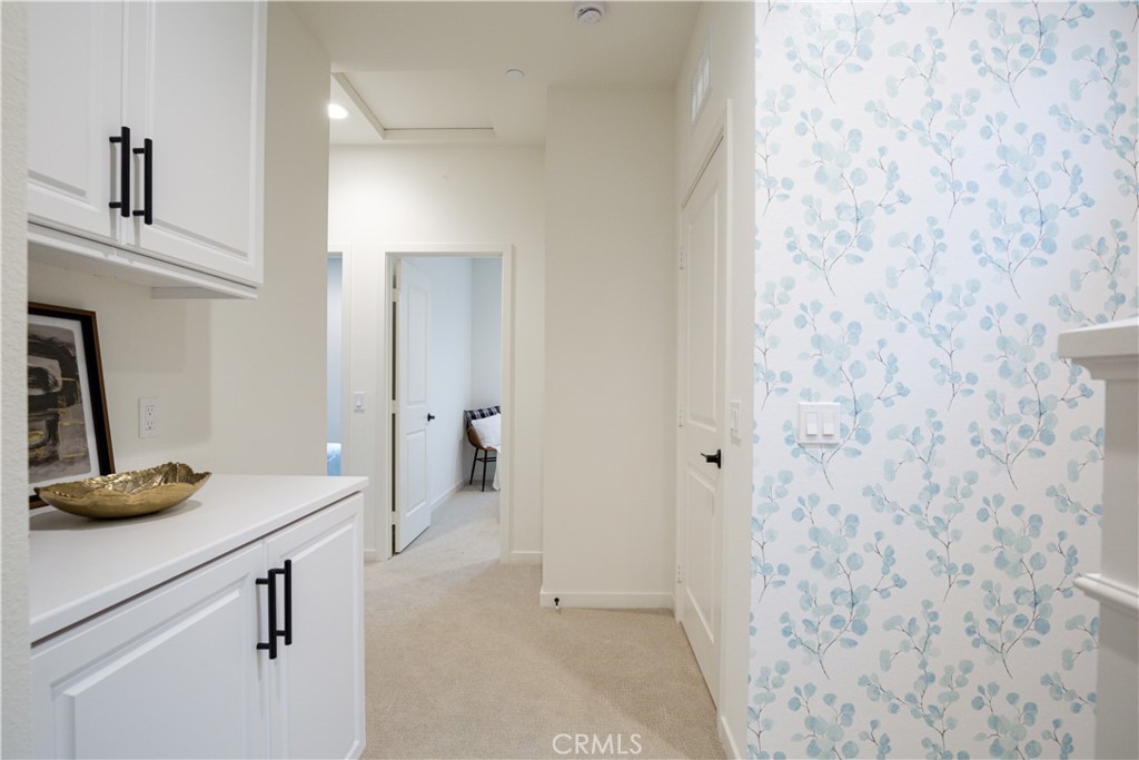 12232 Akira Drive Stanton, CA 90680 - Photo 14 of 39 a view of a bathroom with a sink and a mirror