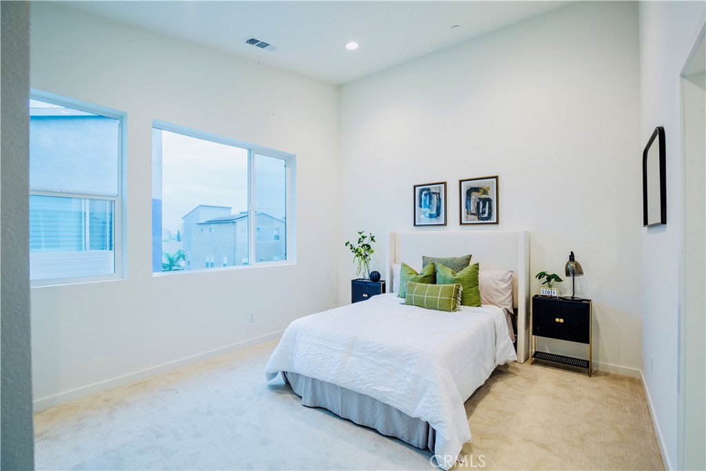 12232 Akira Drive Stanton, CA 90680 - Photo 16 of 39 a bedroom with a bed and a painting on the wall