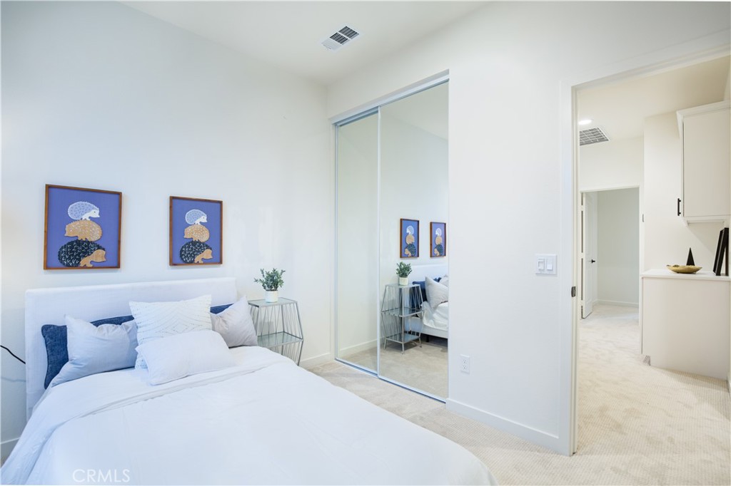 12232 Akira Drive Stanton, CA 90680 - Photo 21 of 39 a bedroom with a bed and a view of bathroom