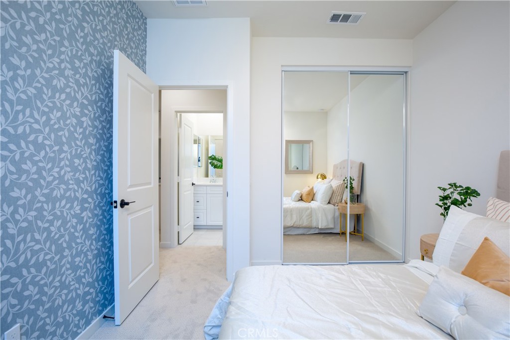 12232 Akira Drive Stanton, CA 90680 - Photo 23 of 39 a bedroom with a bed and a couch