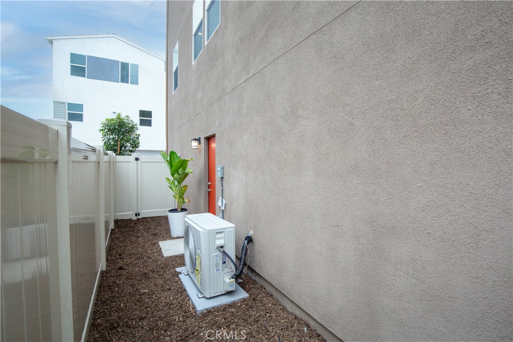 12232 Akira Drive Stanton, CA 90680 - Photo 29 of 39 a white toilet sitting next to a white door