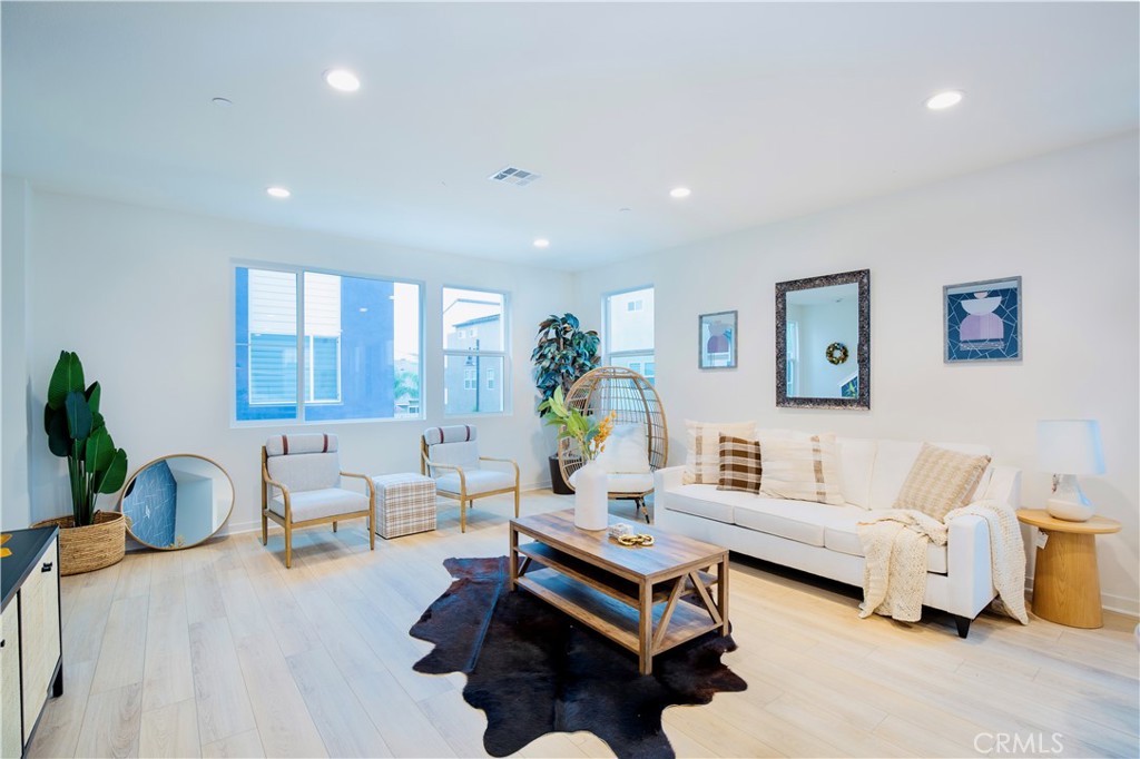 12232 Akira Drive Stanton, CA 90680 - Photo 39 of 39 a living room with furniture and wooden floor