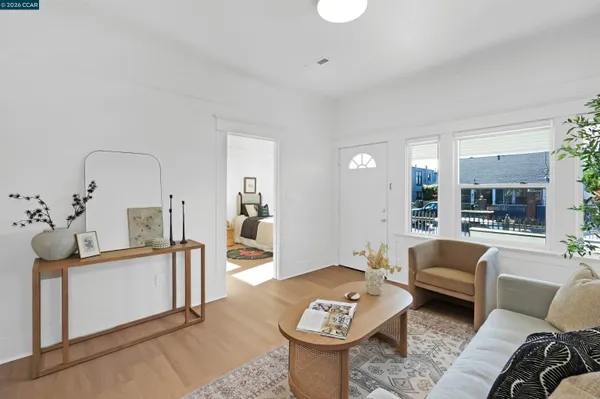 a dining room with furniture and wooden floor