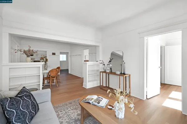 a view of a dining room with furniture and wooden floor